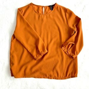 Forever 21 rust colored blouse. 3/4 sleeves with button closure.
